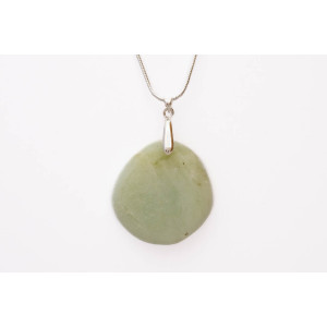 Serprentine green gemstone pendant on a silver coloured necklace