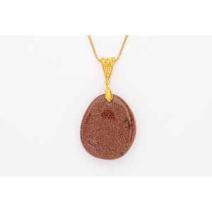 Red Sandstone gemstone pendant on a gold coloured necklace