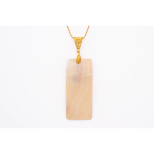 Concave Natural shell pendant on a gold coloured necklace