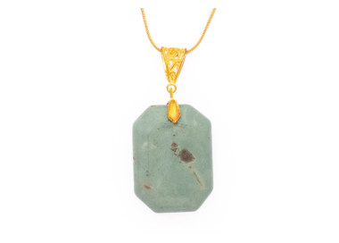 Aventurine gemstone pendant on a gold coloured necklace