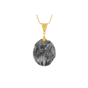 Pinolith black gemstone pendant on a gold coloured necklace