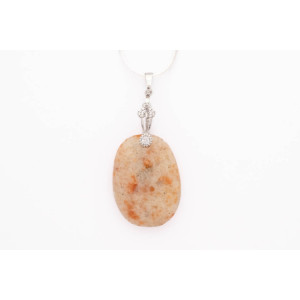 Sunstone cabouchon pendant on a silver coloured necklace