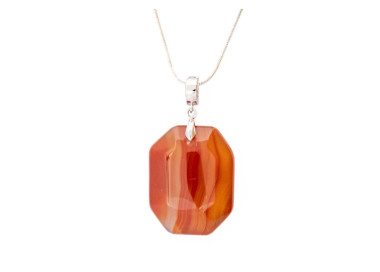 Carnelian red orange gemstone pendant on a silver coloured necklace