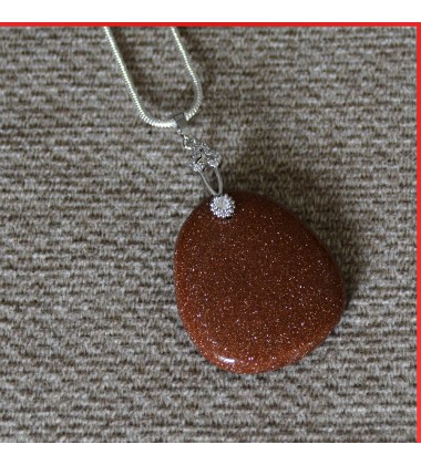 Red Sandstone Pendant on a silver coloured necklace