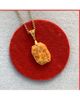 Calcite Red Orange Gemstone Pendant on a gold coloured necklace