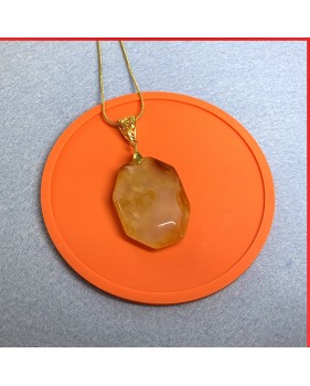 Carnelian red orange gemstone pendant on a gold coloured necklace