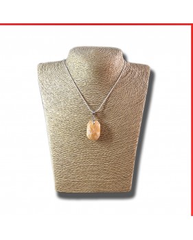 Calcite red orange gemstone pendant on a silver coloured necklace