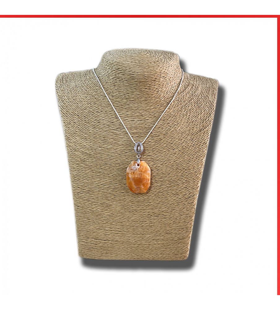 Calcite red orange gemstone pendant on a silver coloured necklace