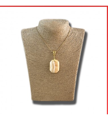 Calcite red orange gemstone pendant on a gold coloured necklace