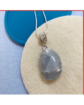 Blue aqua quartz gemstone pendant on a silver coloured necklace