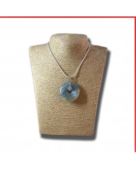 Aragonite gemstone pendant on a silver coloured necklace