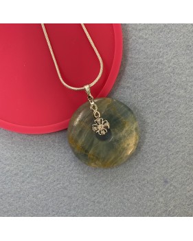 Aragonite gemstone pendant on a silver coloured necklace