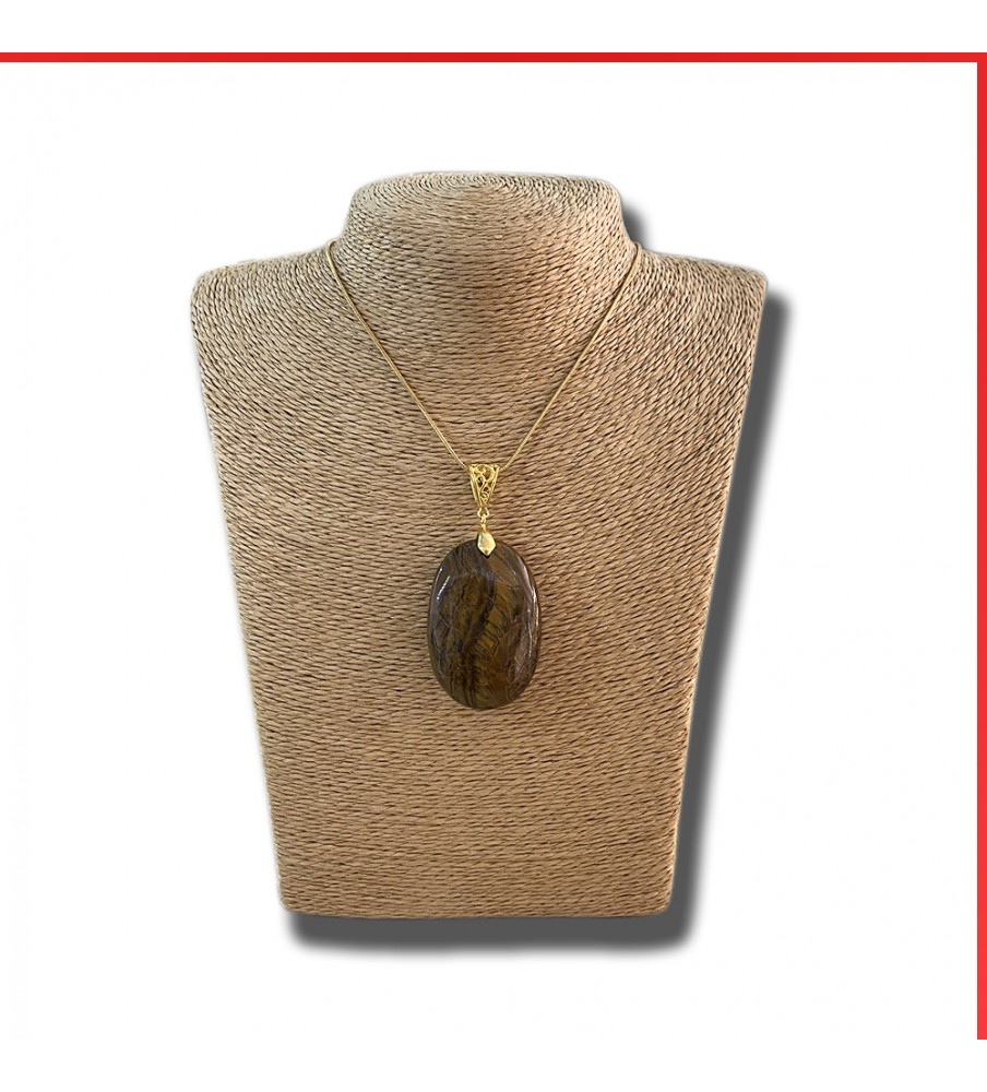 Tiger eye gemstone pendant on a gold coloured necklace