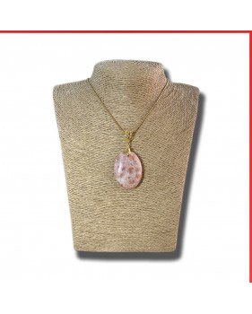 Sunstone cabouchon pendant on a gold coloured necklace
