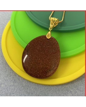 Red Sandstone gemstone pendant on a gold coloured necklace