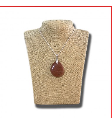 Red Sandstone gemstone pendant on a silver coloured necklace